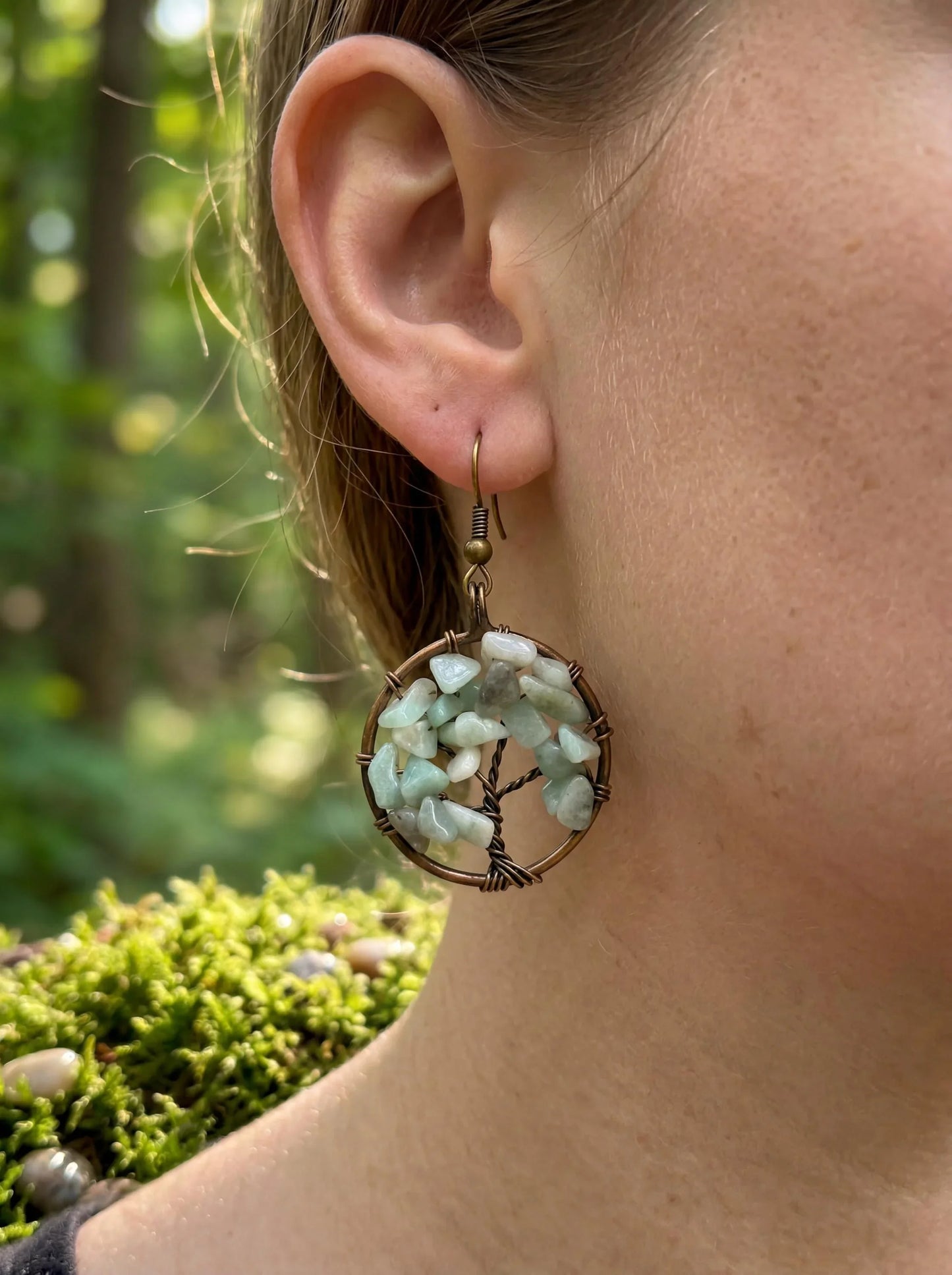 Wire-wrapped earrings with green gemstones, nature-inspired design